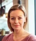 Head And Shoulders Portrait Of Mature Businesswoman Working In Modern Office